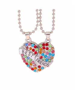Detail view of heart-shaped Best Friends puzzle pendant with colorful rhinestones