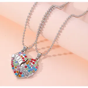 Close-up of Best Friends puzzle heart necklace with colorful rhinestones and bead chain