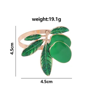 Western style golden napkin ring with green olive leaves and fruit decoration for dining tables