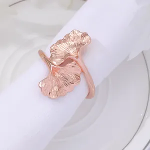 Elegant rose gold ginkgo leaf napkin ring with intricate vein textures for dining
