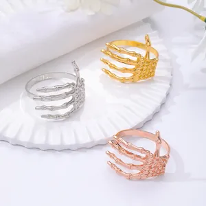 Servilleteros de mano de esqueleto gótico en oro y plata para decoración de Halloween