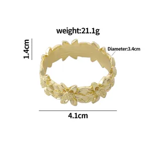 Golden alloy sunflower napkin ring with detailed 3D floral pattern and dimensions info