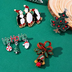 Christmas brooch set with Santa, reindeer, penguin, and bells over green festive texture