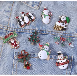 Detailed set of 8 festive Christmas enamel pins pinned on a denim jacket for holiday style