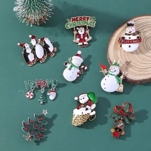 Christmas enamel brooch set featuring Santa, snowman, penguin and tree on dark background