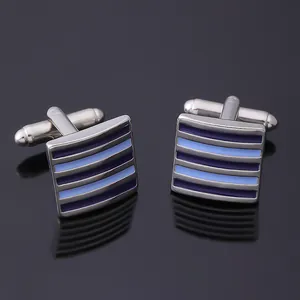 Detailed close-up of premium men's striped enamel cufflinks with silver metal base