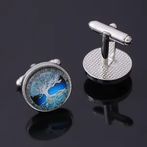 Macro detail of Tree of Life cufflinks with silver finish and toggle closure