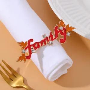 Detail of red Family napkin ring with orange maple leaf and rhinestones for Thanksgiving