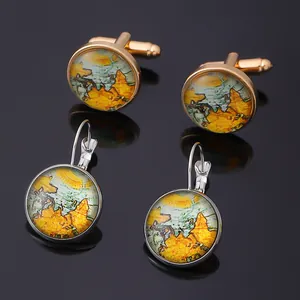 Vintage world map cufflinks and earrings set in gold and silver finish on black background