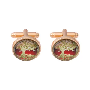 Detail of rose gold tree of life cufflinks with red background and clear glass dome