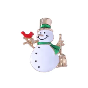 Christmas snowman brooch in white enamel with gold accents and winter scarf design
