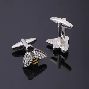 Boutons de manchette abeille argentés avec strass et émail jaune sur fond noir brillant