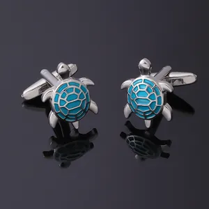 Elegant turtle-shaped silver cufflinks with polished teal enamel and T-shaped closure