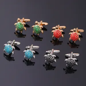 Macro detail of turtle shaped cufflinks in various colors with polished metal finish
