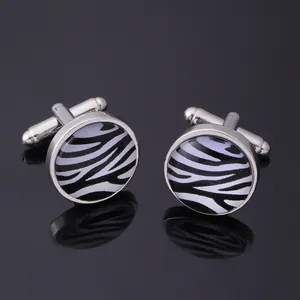 Classic silver-tone cufflinks featuring a circular black and white zebra pattern inlay