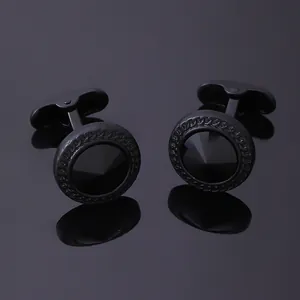 Boutons de manchette ronds noirs mats avec cristal facetté et bordure texturée