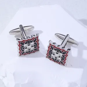 Macro detail of square cufflinks with red and black enamel patterns and T-back closure