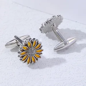 Detailed close-up of yellow sunflower cufflinks with enamel petals and silver metal T-bar back