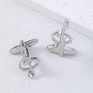 Polished silver musical treble clef cufflinks for men with sparkling crystal accent