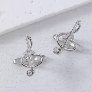 Elegant silver treble clef cufflinks for men featuring a small zircon stone inlay