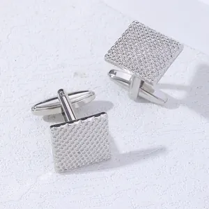 French style square silver cufflinks for men featuring a textured diamond grid pattern