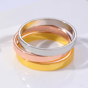 Three-piece metal napkin ring set in gold, rose gold and silver with a polished finish