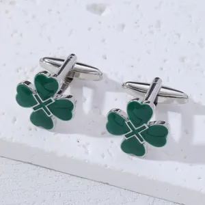 Classic silver cufflinks with four-leaf clover design and deep green enamel finish