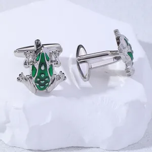Detail of green frog cufflinks with enamel finish and silver-tone T-bar toggle backs