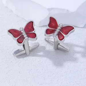 Elegant red butterfly cufflinks with crystal accents for men in a 45-degree side view