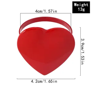 Macro view of red heart napkin ring with dimensions and weight detail for table setting