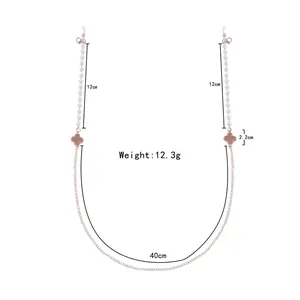 Detail view of 74cm four-leaf clover glasses chain with pearls and lobster clasps