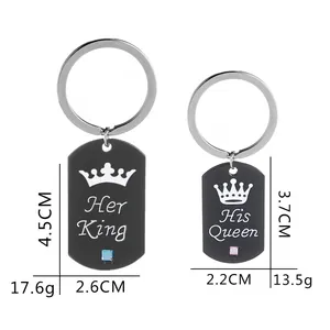 Close-up of Her King and His Queen couple keychains with crown design and zircon stones