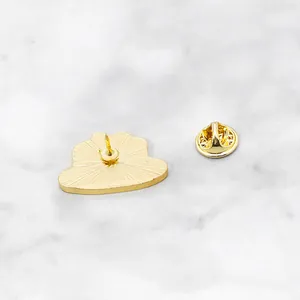 Back view of vintage enamel brooch with shiny gold finish and butterfly clutch backing