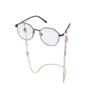 Elegant glasses chain with imitation pearls and gold butterflies on metal frame glasses