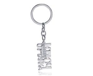 Porte-clés Hawaii en métal argenté avec lettres et pendentif en forme de tambour