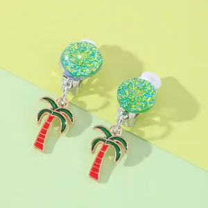 Detail of tropical palm tree clip-on earrings with green glitter and soft rubber pads