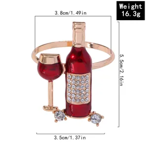 Elegant gold napkin ring with red enamel wine bottle and glass design with zircons