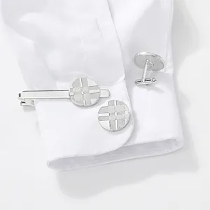 Silver mens business tie clip and cufflinks set with geometric grid pattern on white shirt