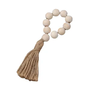 Rustic wood bead napkin ring with natural jute rope tassels for table decoration