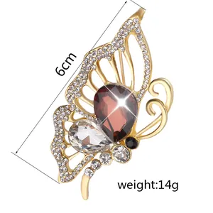 Detailed view of hollow butterfly brooch with rhinestones measuring 6cm and 14g