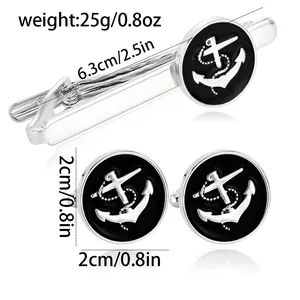 Mens anchor cufflinks and tie clip set with nautical silver emblem on black background