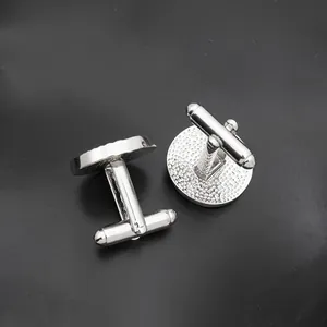 Classic silver round cufflinks with textured back and T-shaped swivel closure for men