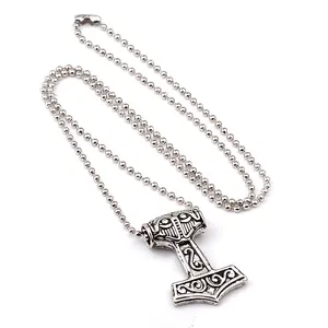 Vintage silver Viking Mjolnir pendant necklace with intricate Nordic floral engraving