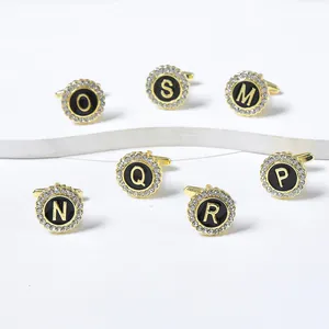 Elegant round black cufflinks with gold initials and sparkling crystal border set