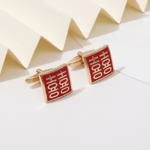 Detail of square gold cufflinks with red enamel and Chinese Double Happiness wedding character