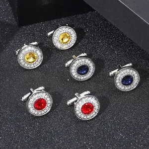 Polished silver cufflinks with vibrant crystals in red, blue, and yellow for dress shirts