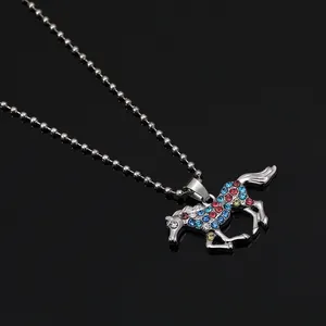Detail of unicorn pendant necklace with colorful rhinestones on silver bead chain