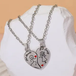 Detailed view of split heart pendants with 'Her Weirdo' and 'His Crazy' engravings