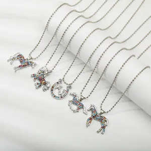 Detail of five kids unicorn necklaces with silver bead chains and colorful rhinestones