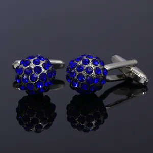 Silver-plated cufflinks with spherical blue crystals and polished metallic finish